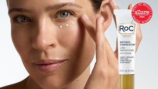 Woman applying eye cream with ROC Retinol Correxion on a white background