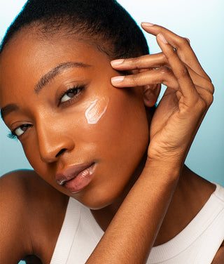 Model with RoC Moisturizer swatch on her cheek