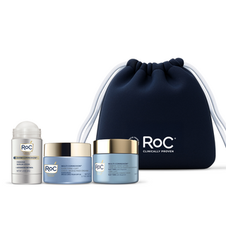 RoC skincare products (Derm Correxion Firming Serum Stick, Even Tone + Lift Chest, Neck & Face Cream SPF 30, Firm + Lift Anti-Sagging Firming Cream) with a navy holiday cosmetic bag on a white background.