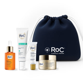 RoC skincare products (Revive + Glow DAILY SERUM, Hydration+ MOISTURIZER SPF, LINE SMOOTHING EYE CREAM, LINE SMOOTHING MAX HYDRATION CEAM) with a navy holiday cosmetic bag on a white background