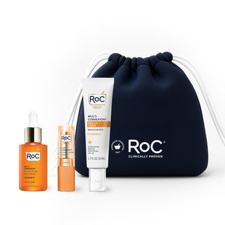 RoC skincare products (Revive + Glow DAILY SERUM, Revive + Glow EYE BALM, REVIVE + GLOW MOISTURIZER SPF) with a navy holiday cosmetic bag on a white background