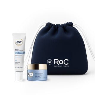 RoC skincare products (even tone + lift MOISTURIZER SPF, even tone + lift night cream) with a navy holiday cosmetic bag on a white background
