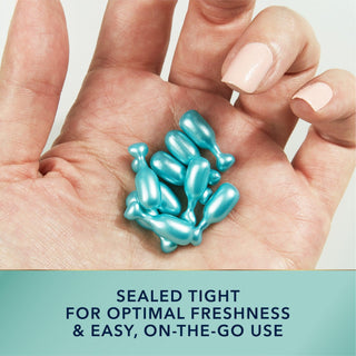 Image of hand holding MULTI CORREXION® Hydrate + Plump Serum Capsules. Sealed tight for optimal freshness & easy, on-the-go use