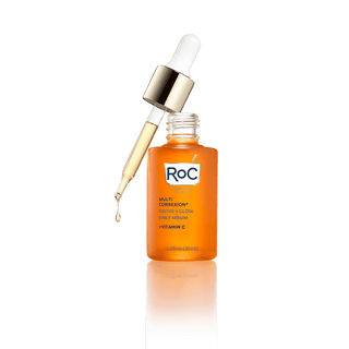Image of MULTI CORREXION® Revive and Glow Daily Serum bottle with dropper applicator sitting on top