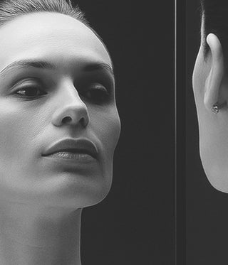 Close-up of a person's face with a focus on an earring.