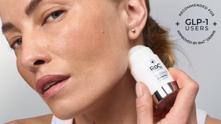 Close-up of a woman holding a white and silver Roc Retinol cream bottle against her cheek, with text in the top right stating 'Recommended for + GLP-1 users Approved by ROC Dermis'.
