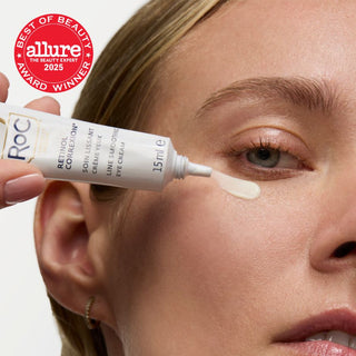 Person applying RoC eye cream to their face with Allure Best of Beauty 2025 award visible.