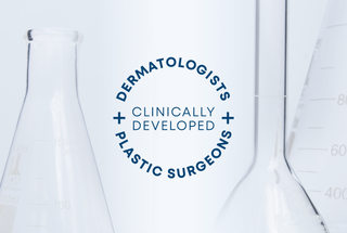Clinically developed with Dermatologists and Plastic Surgeons seal over a background showing scientific beakers