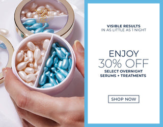 30% Off Select Overnight Serums + Treatments - Image of model's hand holding the Plumping Power Serum Capsules Duo