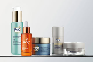Collection of RoC products on a white background, including Multi Correxion Hydrate + Plump Moisturizer, Revive + Glow Serum, Multi Correxion Anti-Sagging Firming Cream, Derm Correxion Firming Serum Stick, and Derm Correxion Dual Eye Cream.