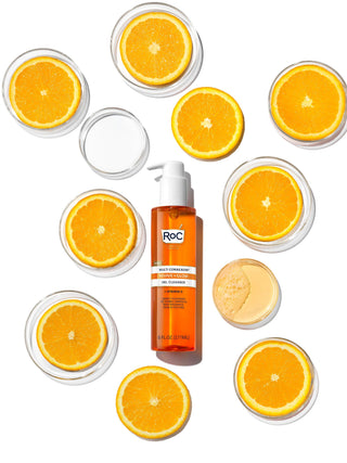 Image of MULTI CORREXION® Revive + Glow Gel Cleanser bottle surrounded by orange slices to represent Vitamin C